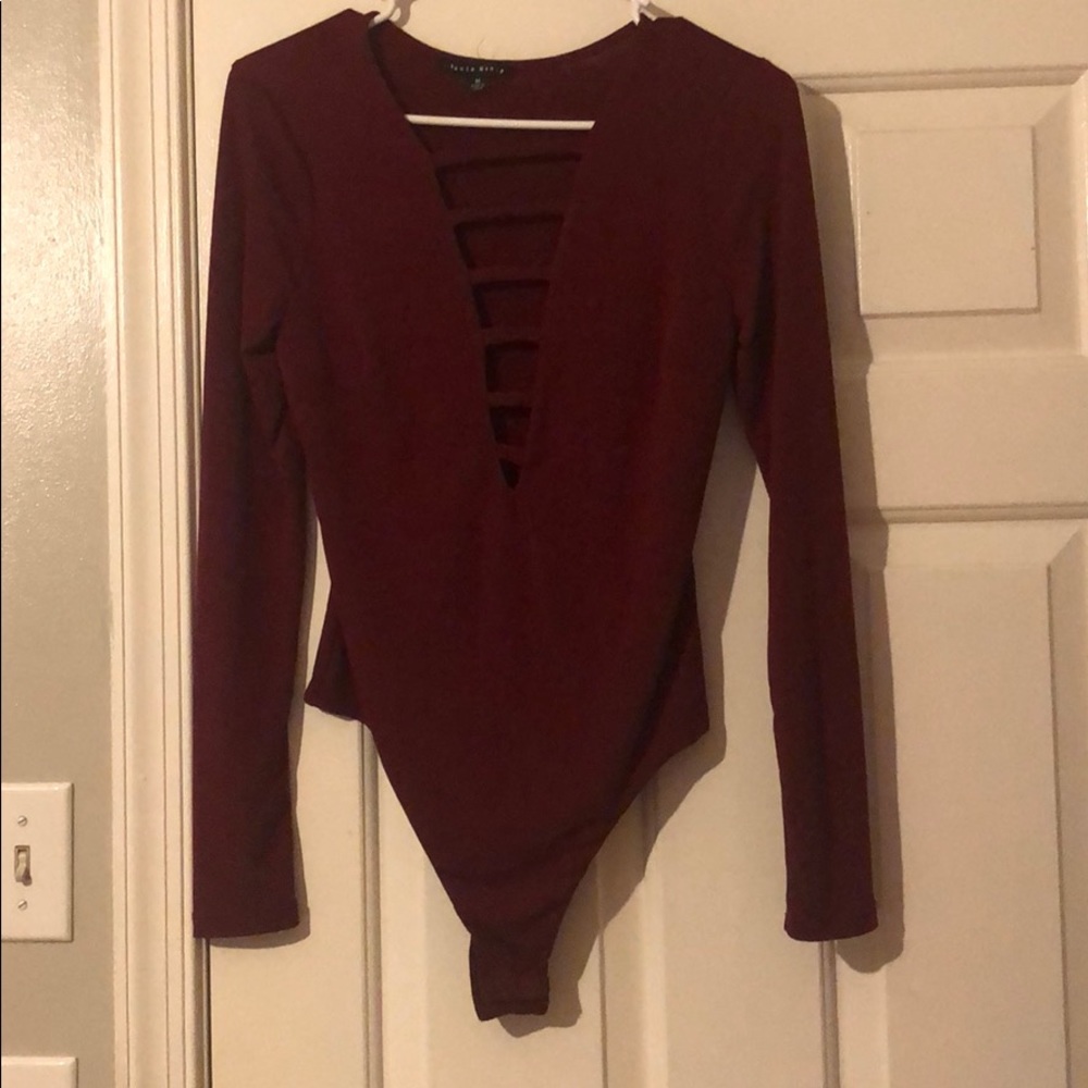 maroon body suit with cut outs